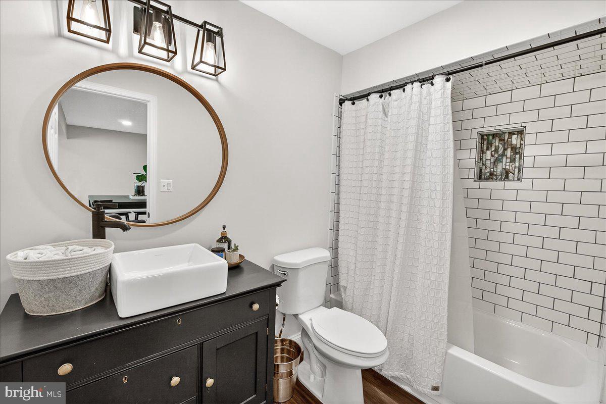 411 William Plummer Street New Market, MD 21774 - Photo 61 of 89 a bathroom with a sink a toilet and a mirror