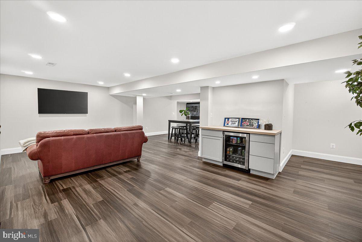 411 William Plummer Street New Market, MD 21774 - Photo 65 of 89 a living room with furniture and a flat screen tv