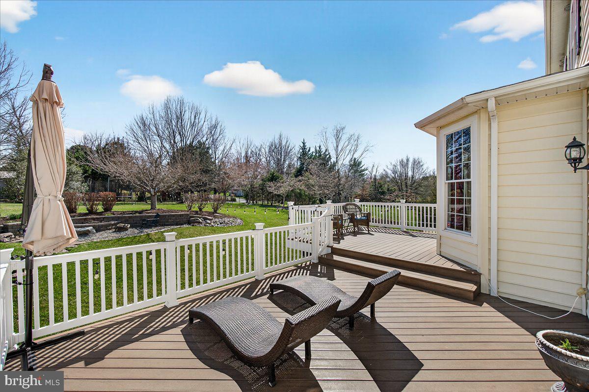 411 William Plummer Street New Market, MD 21774 - Photo 78 of 89 a view of a chairs and table on the deck
