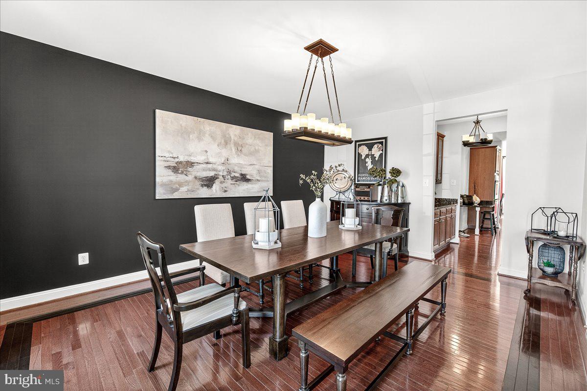 411 William Plummer Street New Market, MD 21774 - Photo 8 of 89 a view of a dining room with furniture a chandelier and wooden floor