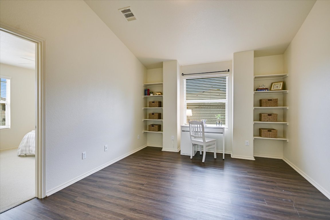 7212 Lookout Bluff Terrace, Unit D18 Austin, TX 78735 - Photo 12 of 22 wooden floor in an empty room with a window
