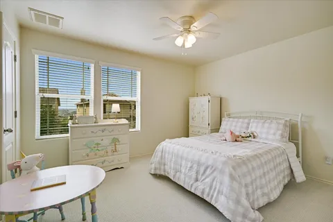 a bedroom with a bed and a table