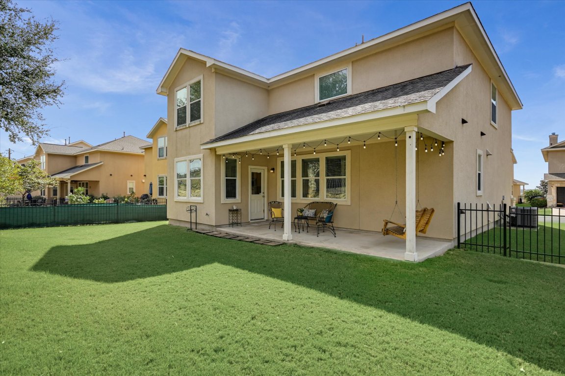 7212 Lookout Bluff Terrace, Unit D18 Austin, TX 78735 - Photo 22 of 22 a view of a house with a yard and sitting area