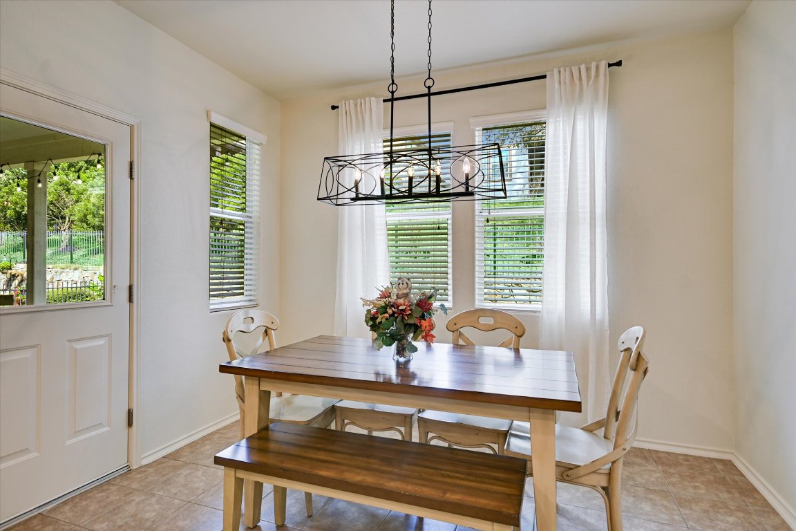 7212 Lookout Bluff Terrace, Unit D18 Austin, TX 78735 - Photo 5 of 22 a view of a dining room with furniture window and outside view