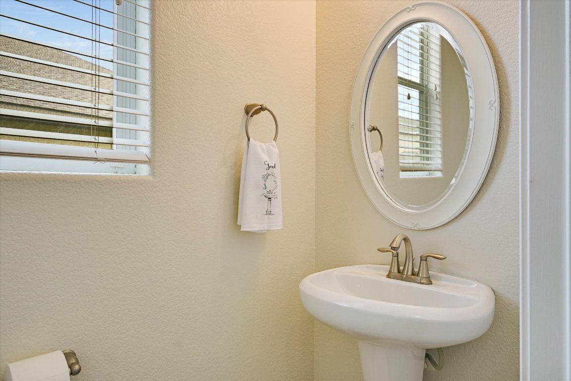 7212 Lookout Bluff Terrace, Unit D18 Austin, TX 78735 - Photo 9 of 22 a bathroom with a sink and a mirror