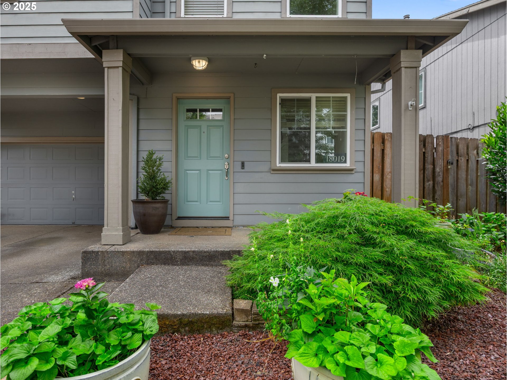 18019 Carlson Avenue Sandy, OR 97055 - Photo 15 of 23 a front view of a house with garden