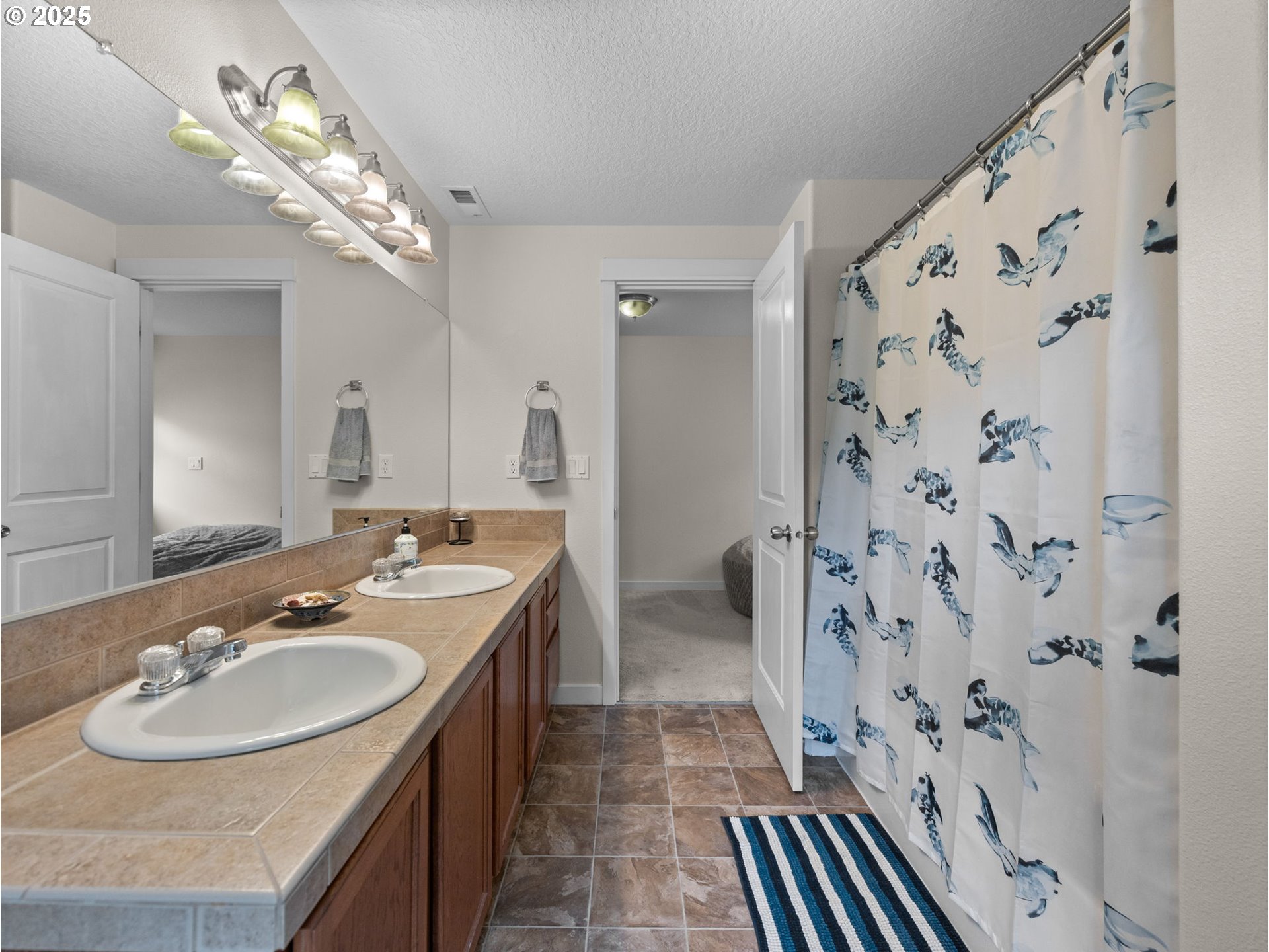 18019 Carlson Avenue Sandy, OR 97055 - Photo 20 of 23 a bathroom with a sink double vanity and a mirror