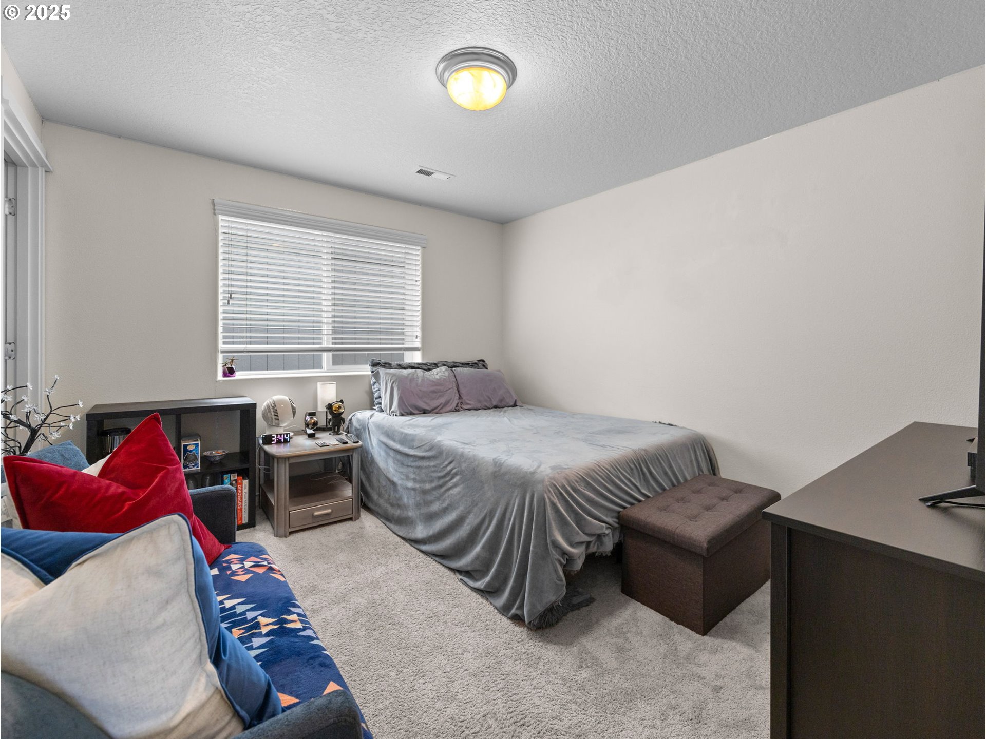 18019 Carlson Avenue Sandy, OR 97055 - Photo 21 of 23 a bedroom with a bed and a couch