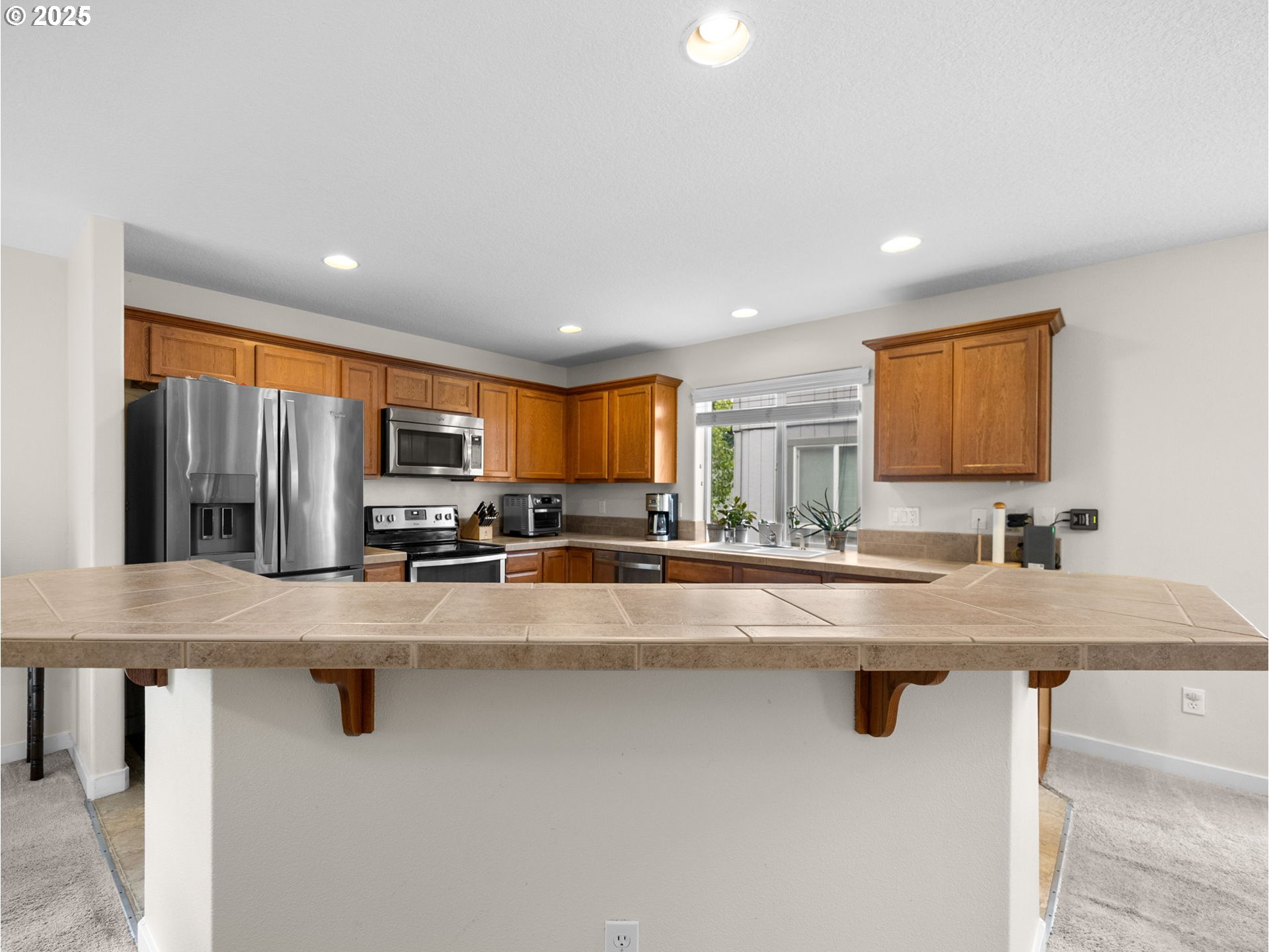 18019 Carlson Avenue Sandy, OR 97055 - Photo 9 of 23 a kitchen with stainless steel appliances granite countertop a sink window and cabinets