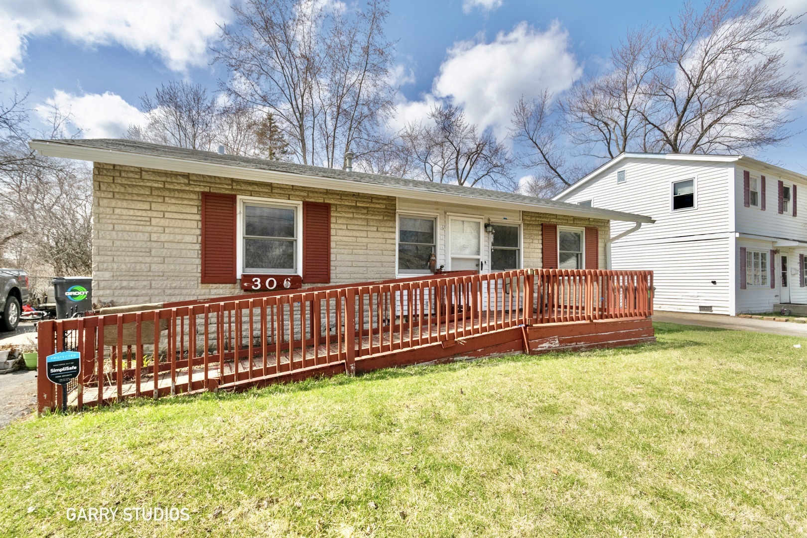 306 South Oltendorf Road Streamwood, IL 60107 - Photo 1 of 15 a view of a house with a backyard and wooden fence