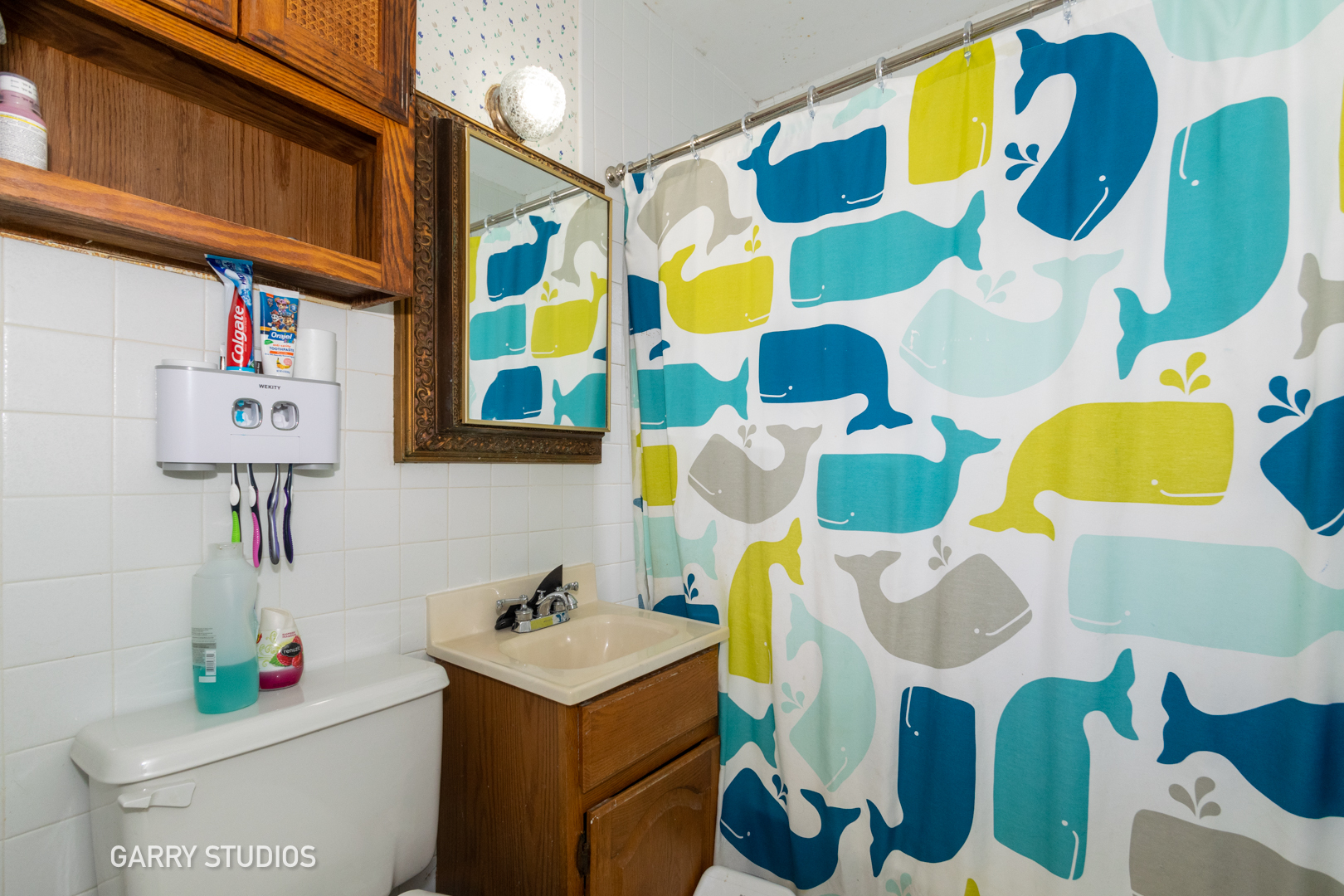 306 South Oltendorf Road Streamwood, IL 60107 - Photo 12 of 15 a bathroom with a sink and mirror with bathtub