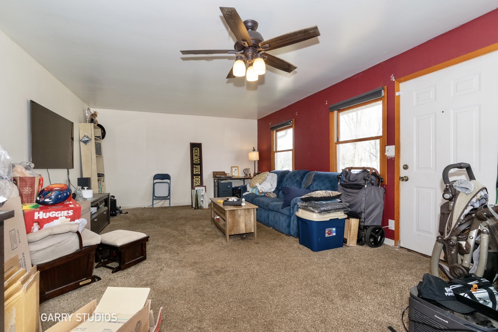 306 South Oltendorf Road Streamwood, IL 60107 - Photo 3 of 15 a living room with furniture a flat screen tv and a window