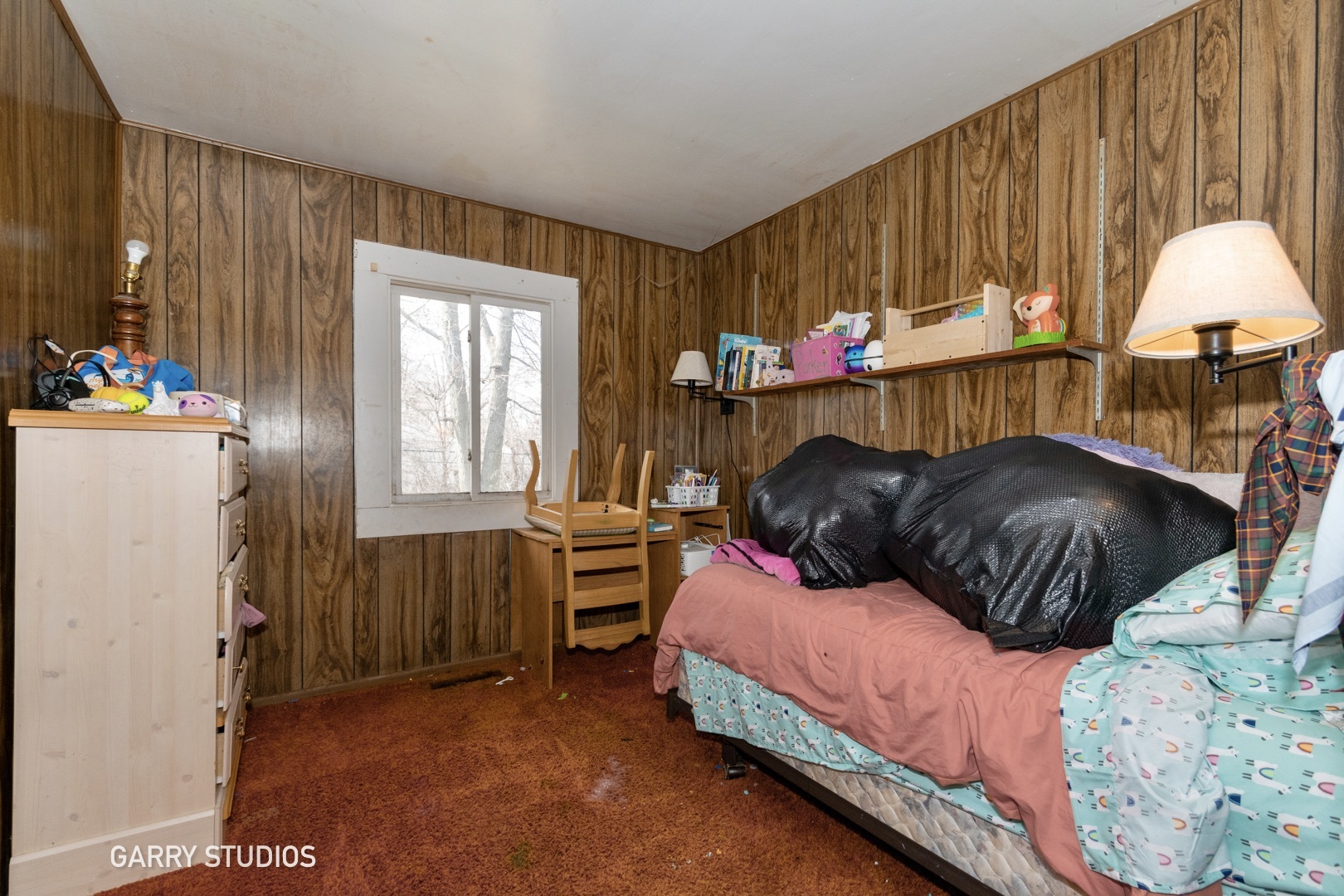 306 South Oltendorf Road Streamwood, IL 60107 - Photo 10 of 15 a bedroom with a bed and a table