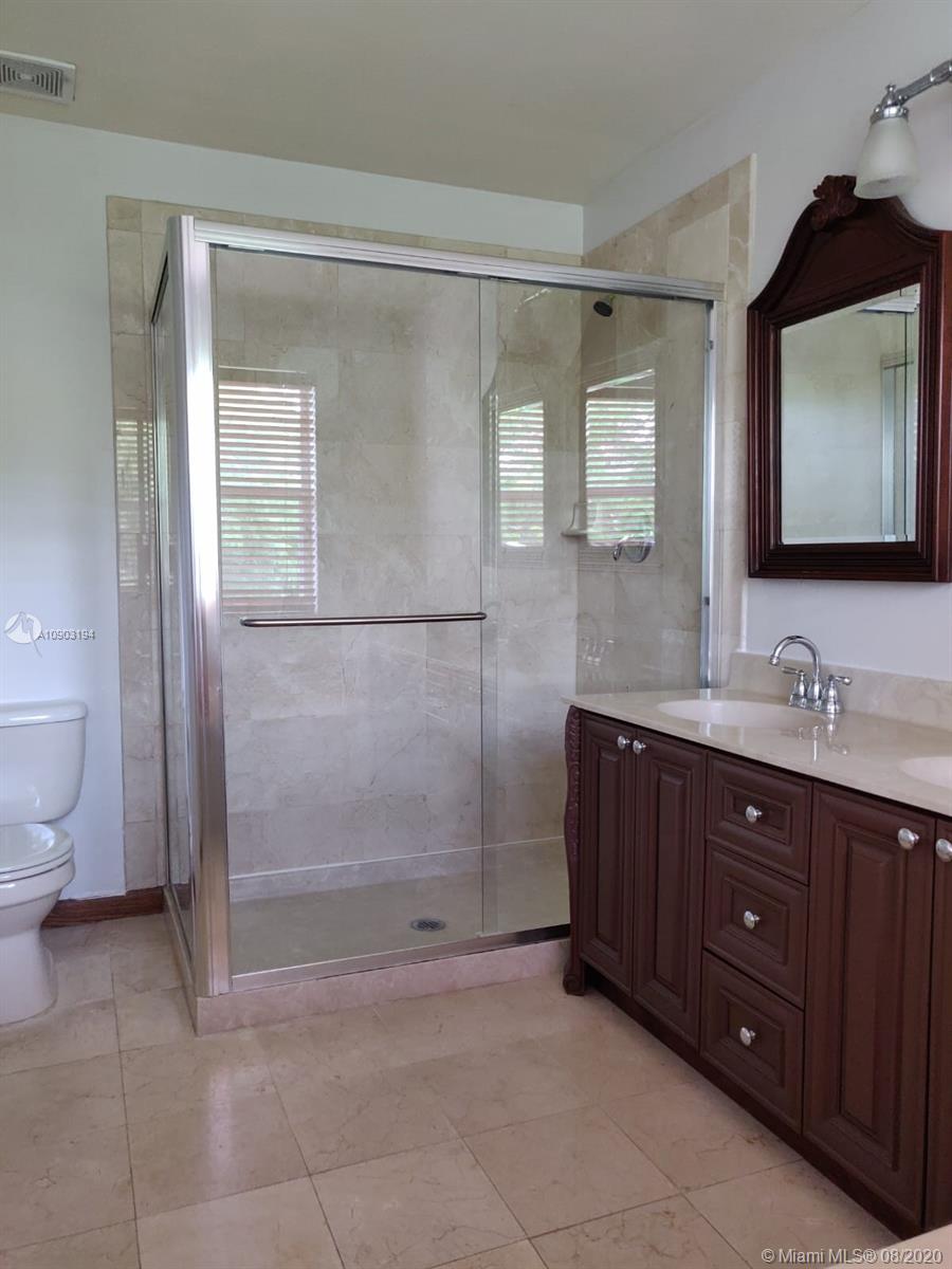 15751 Southwest 20th Street Miramar, FL 33027 - Photo 18 of 34 a bathroom with a sink a toilet and shower