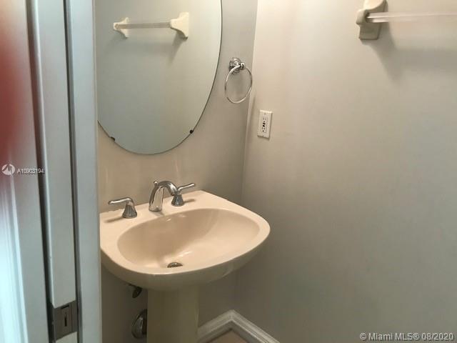 15751 Southwest 20th Street Miramar, FL 33027 - Photo 19 of 34 a bathroom with a sink and mirror