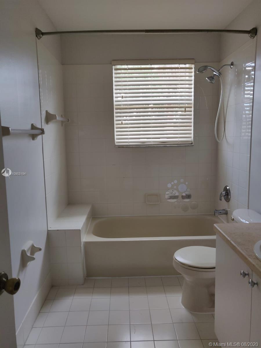 15751 Southwest 20th Street Miramar, FL 33027 - Photo 20 of 34 a bathroom with a toilet a sink and bathtub