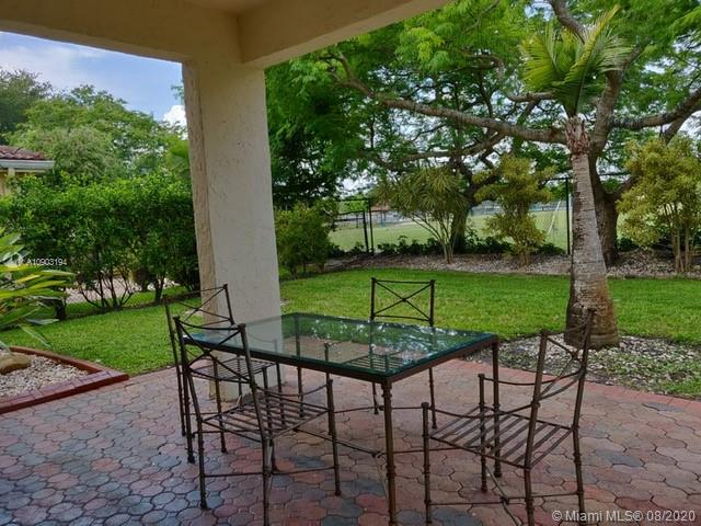 15751 Southwest 20th Street Miramar, FL 33027 - Photo 25 of 34 a view of a chairs and table in the garden