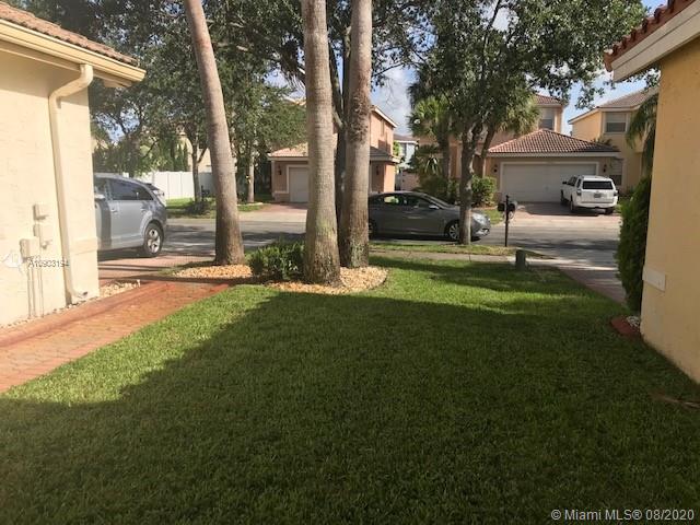 15751 Southwest 20th Street Miramar, FL 33027 - Photo 26 of 34 a garden with trees in front of it