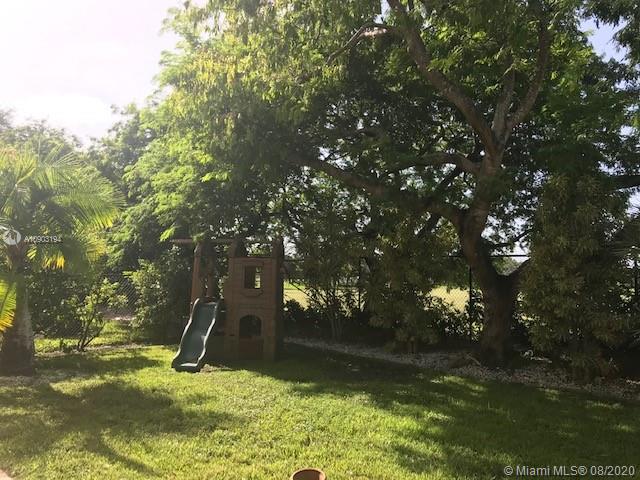 15751 Southwest 20th Street Miramar, FL 33027 - Photo 28 of 34 a view of a tree in a yard