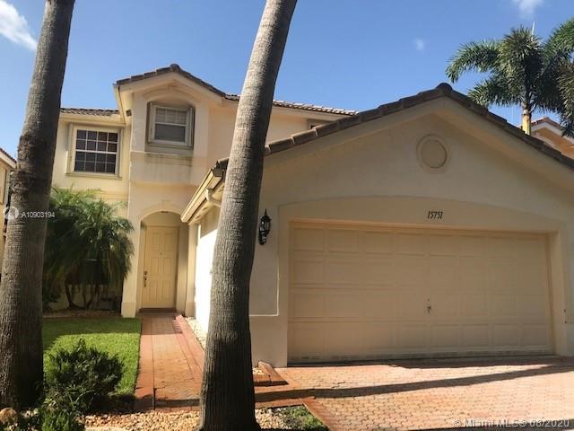 15751 Southwest 20th Street Miramar, FL 33027 - Photo 3 of 34 a front view of a house with a yard