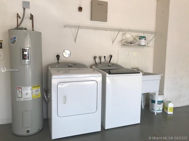 15751 Southwest 20th Street Miramar, FL 33027 - Photo 31 of 34 a utility room with dryer and washer