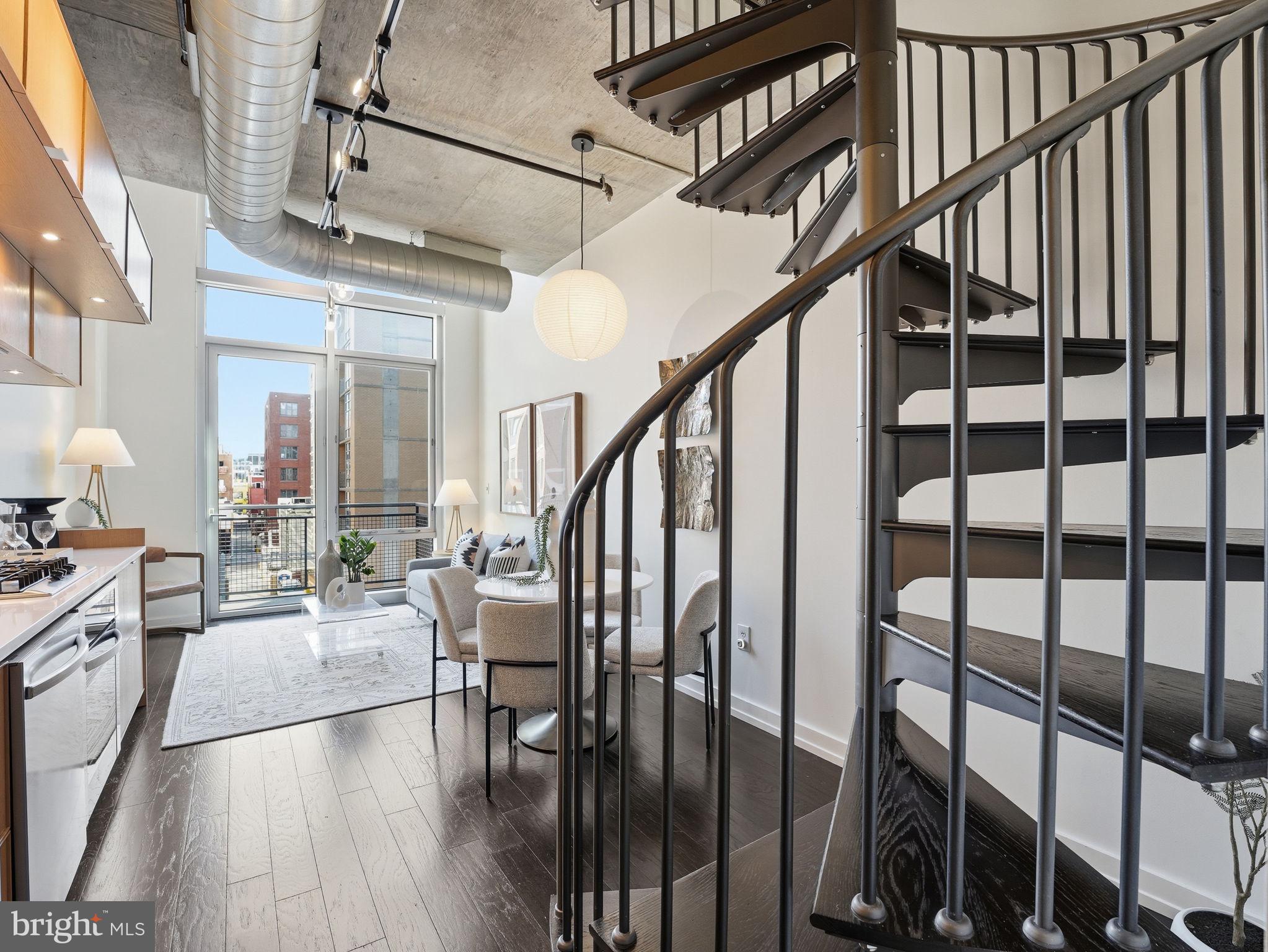 1515 15th Street Northwest, Unit 403 Washington, DC 20005 - Photo 9 of 26 Spiral staircase leads to primary suite.