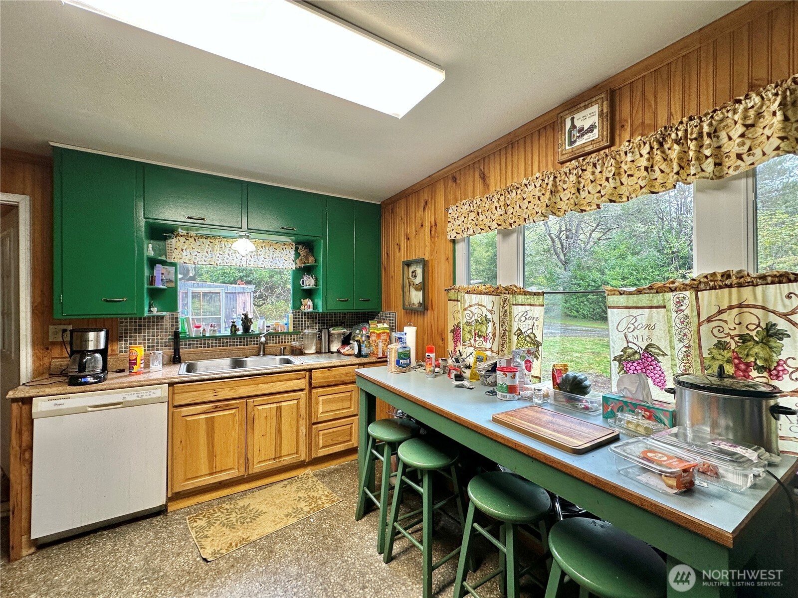 945 Highway 101 Cosmopolis, WA 98537 - Photo 11 of 39 a kitchen with a sink and cabinets