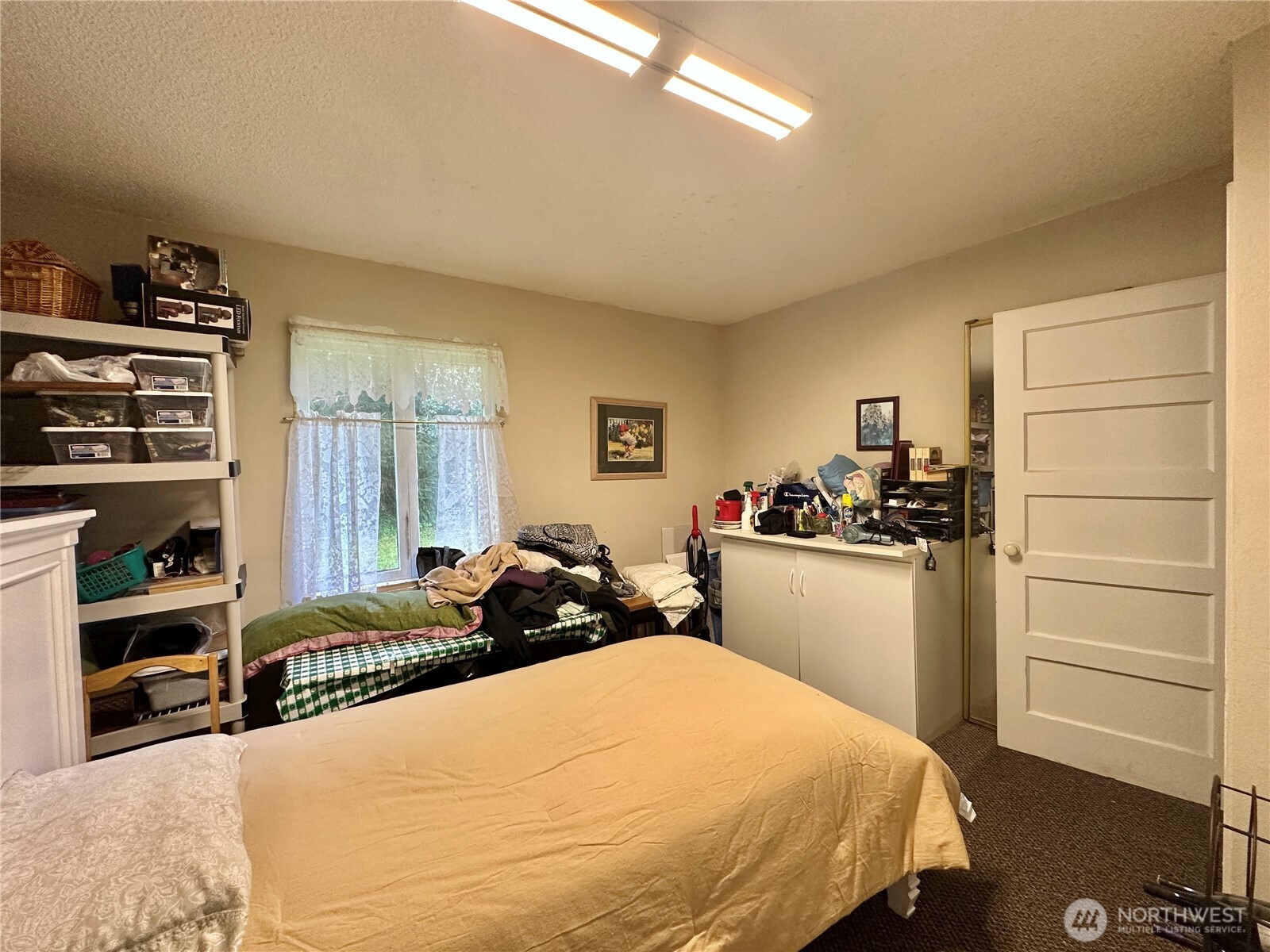 945 Highway 101 Cosmopolis, WA 98537 - Photo 14 of 39 a bedroom with a bed and a cabinets