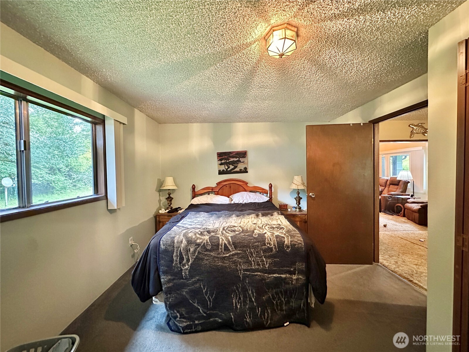 945 Highway 101 Cosmopolis, WA 98537 - Photo 18 of 39 a bed sitting in a bedroom next to a window