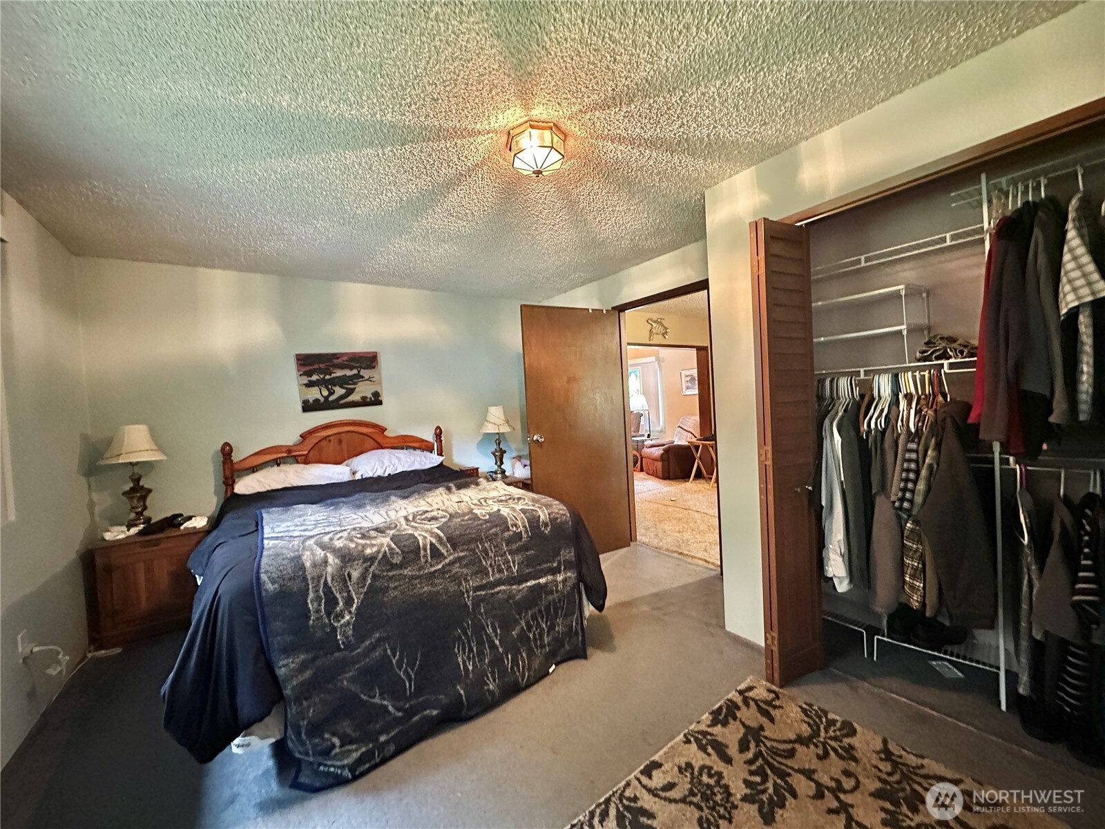945 Highway 101 Cosmopolis, WA 98537 - Photo 19 of 39 a bedroom with a bed and a mirror