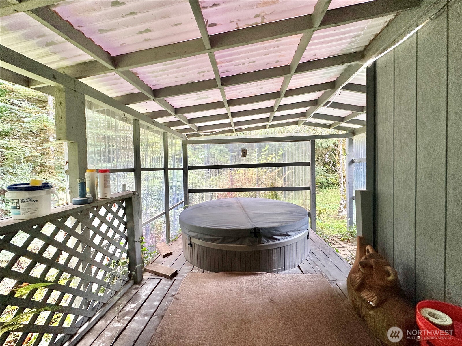 945 Highway 101 Cosmopolis, WA 98537 - Photo 25 of 39 a living room with a bed and a chandelier