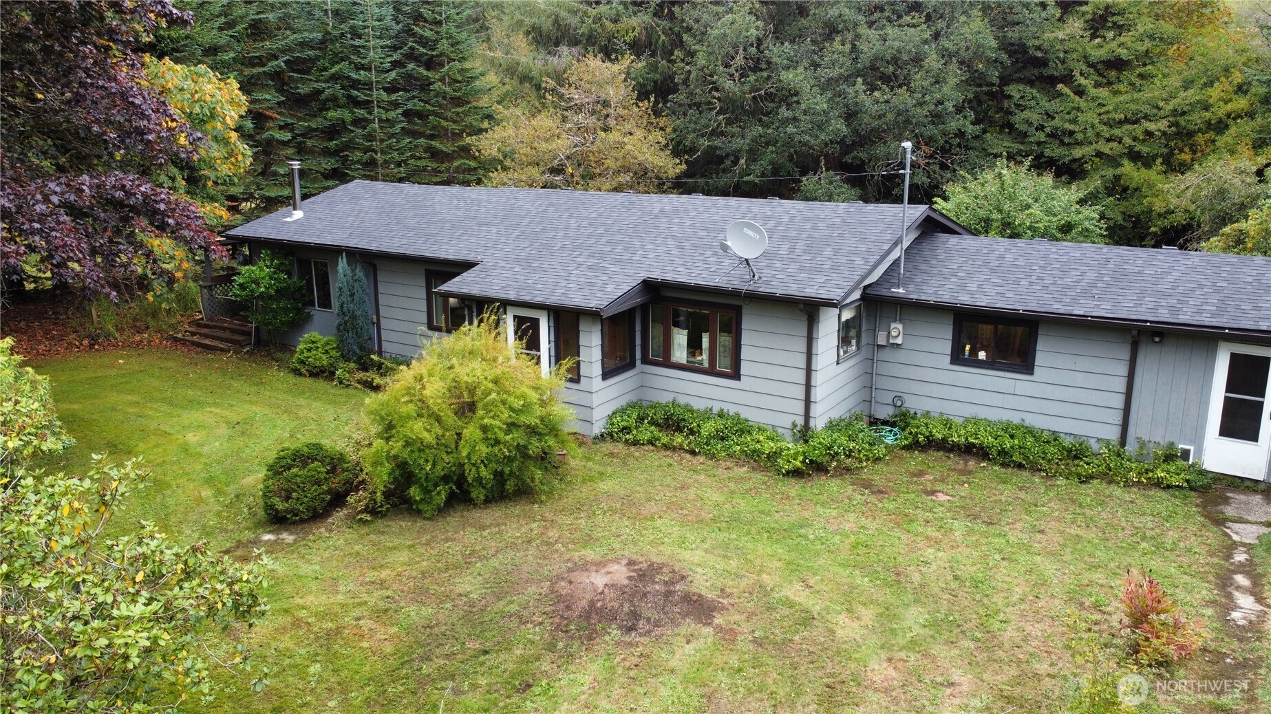 945 Highway 101 Cosmopolis, WA 98537 - Photo 37 of 39 a view of a house with a yard plants and large tree