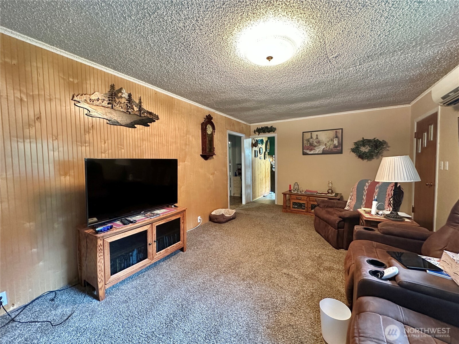 945 Highway 101 Cosmopolis, WA 98537 - Photo 4 of 39 a living room with furniture and a flat screen tv