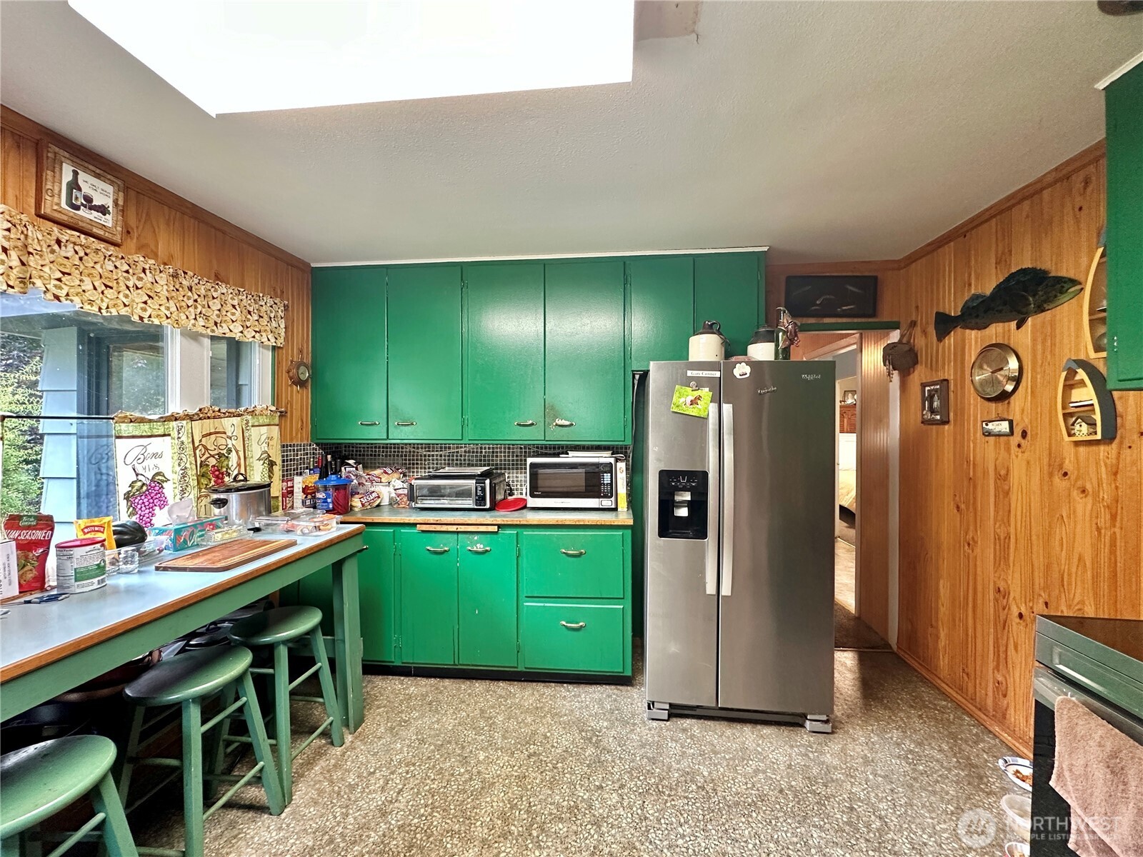 945 Highway 101 Cosmopolis, WA 98537 - Photo 9 of 39 a kitchen with a refrigerator and a sink