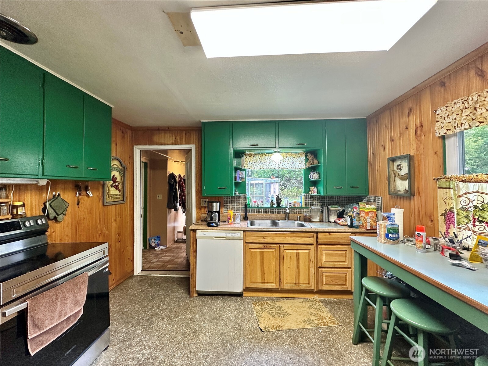 945 Highway 101 Cosmopolis, WA 98537 - Photo 10 of 39 a kitchen with a sink and cabinets
