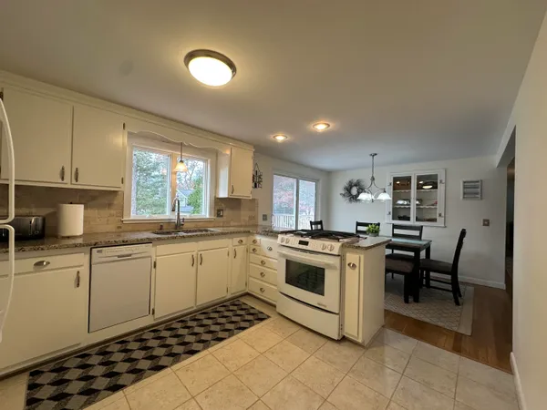 a kitchen with a sink and appliances