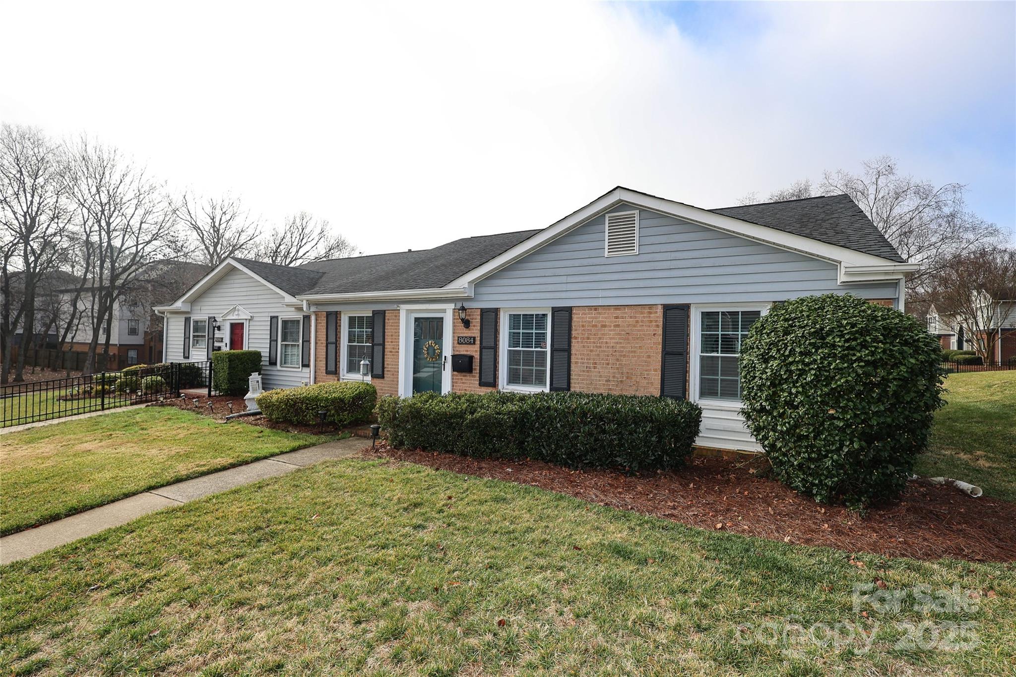 8084 Knights Bridge Road Charlotte, NC 28210 - Photo 1 of 30 a front view of a house with garden
