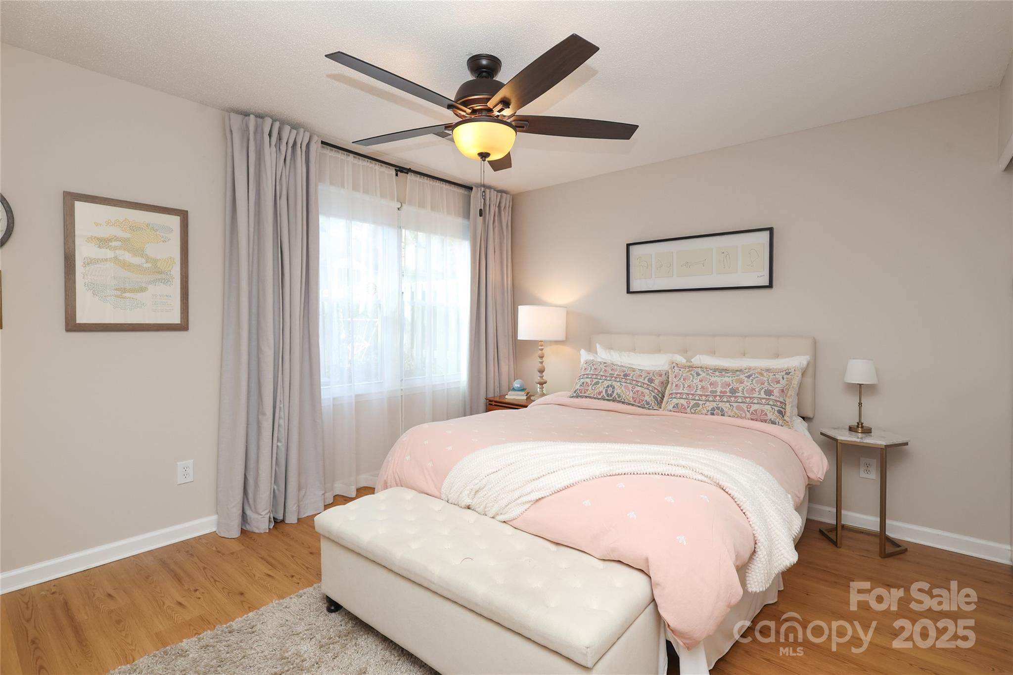 8084 Knights Bridge Road Charlotte, NC 28210 - Photo 14 of 30 a bedroom with a bed and painting on the wall