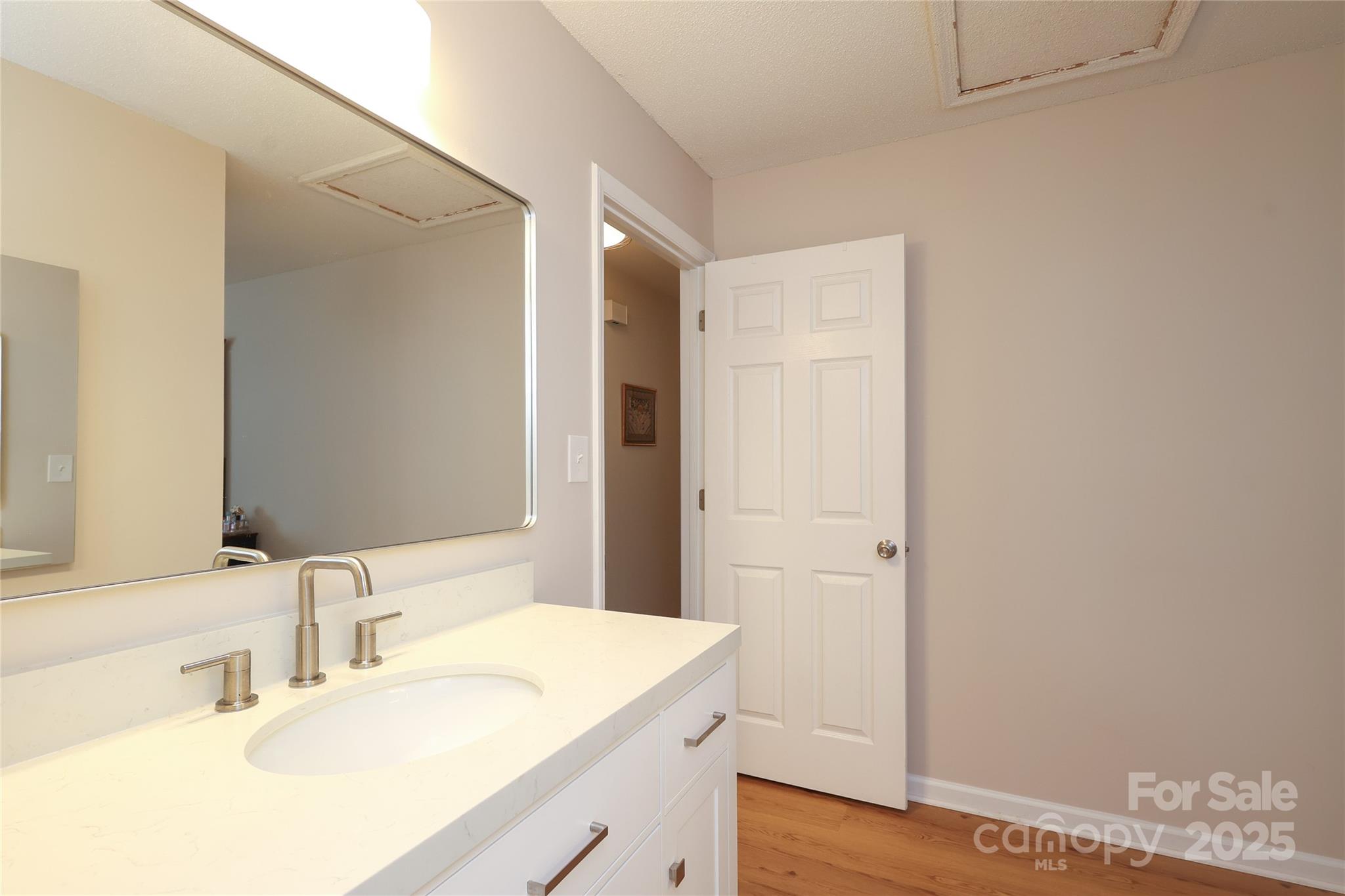 8084 Knights Bridge Road Charlotte, NC 28210 - Photo 18 of 30 a bathroom with a sink and a mirror