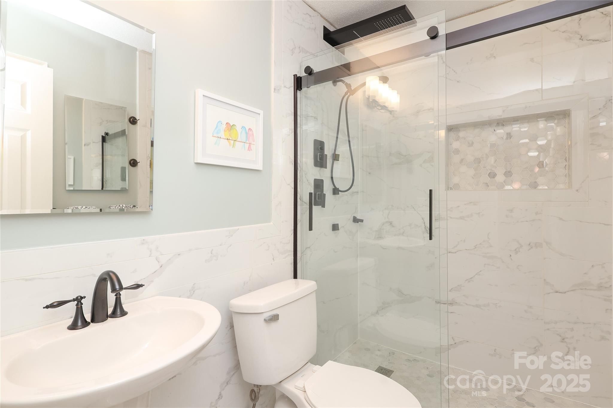 8084 Knights Bridge Road Charlotte, NC 28210 - Photo 21 of 30 a bathroom with a sink toilet and shower