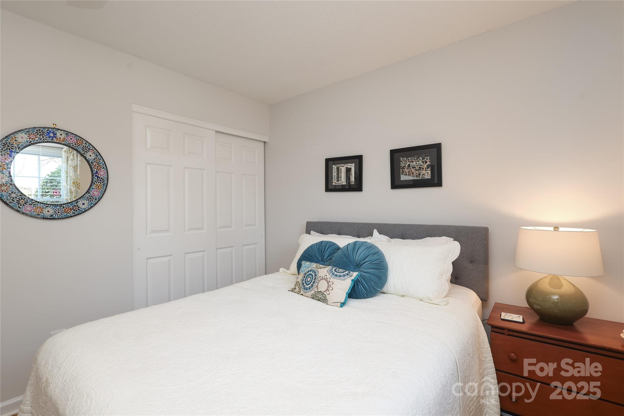 8084 Knights Bridge Road Charlotte, NC 28210 - Photo 23 of 30 a bedroom with a bed and a painting on the wall