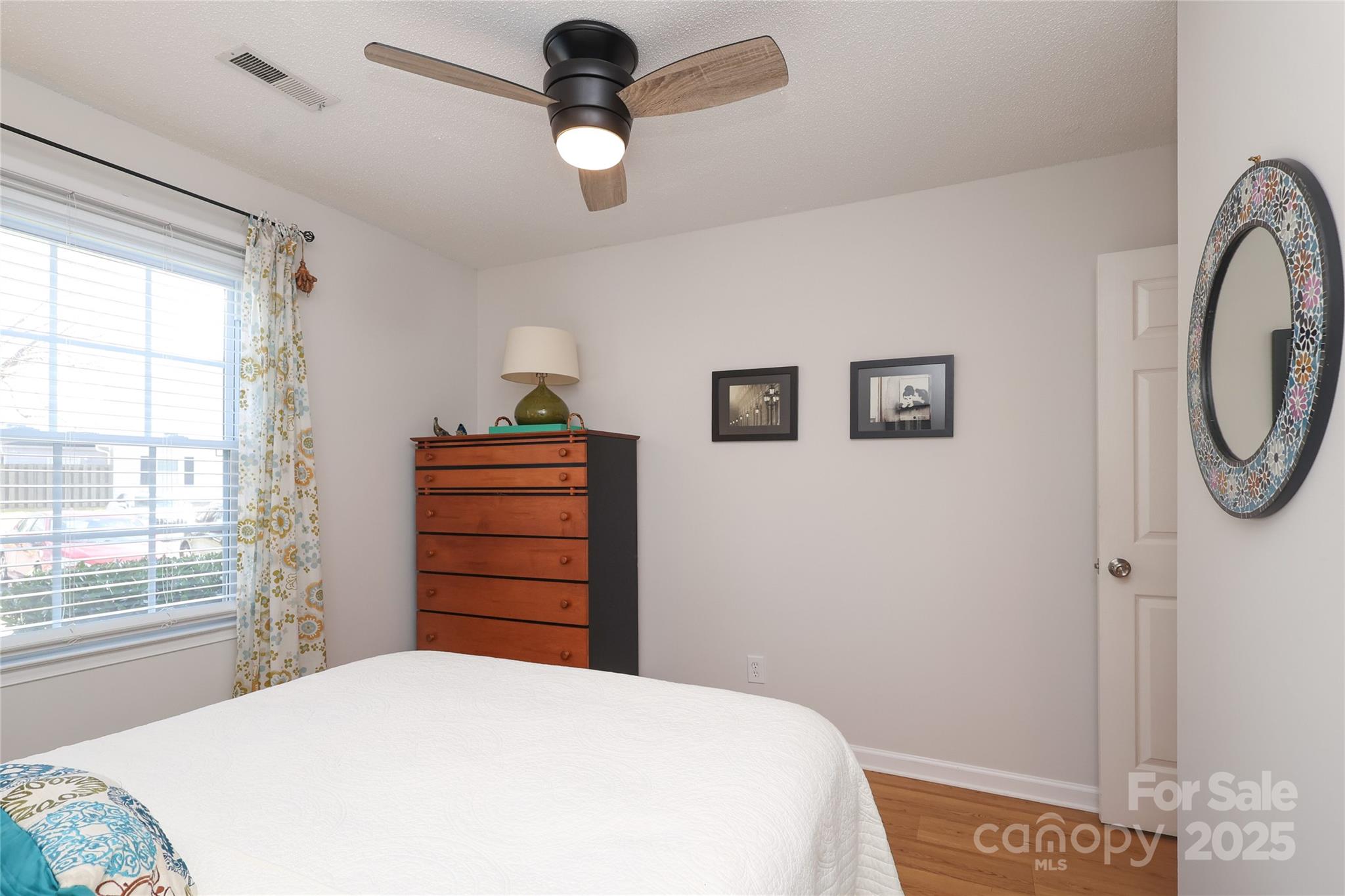 8084 Knights Bridge Road Charlotte, NC 28210 - Photo 24 of 30 a bedroom with a bed and a window