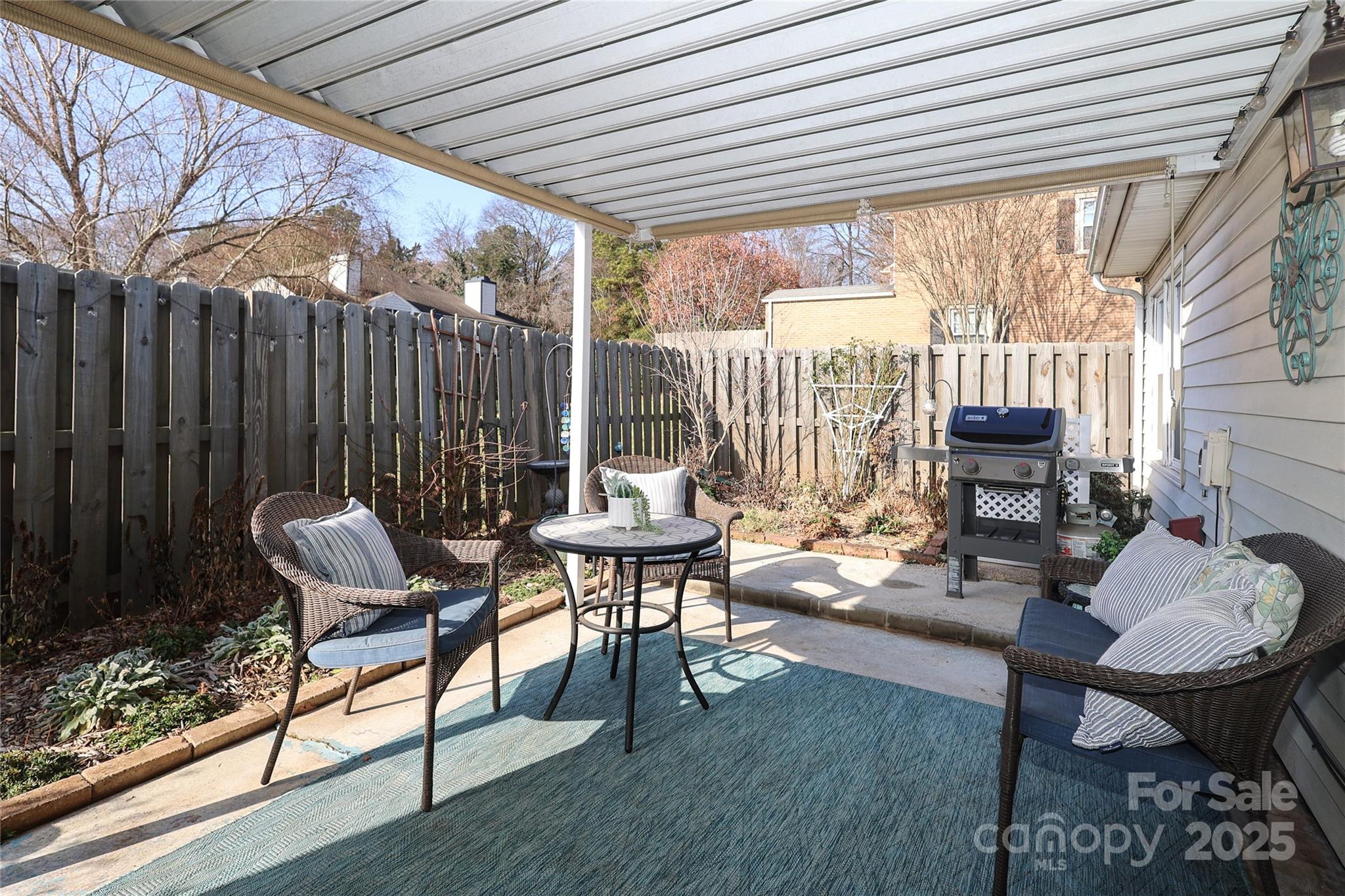 8084 Knights Bridge Road Charlotte, NC 28210 - Photo 25 of 30 a view of a patio with couple of chairs