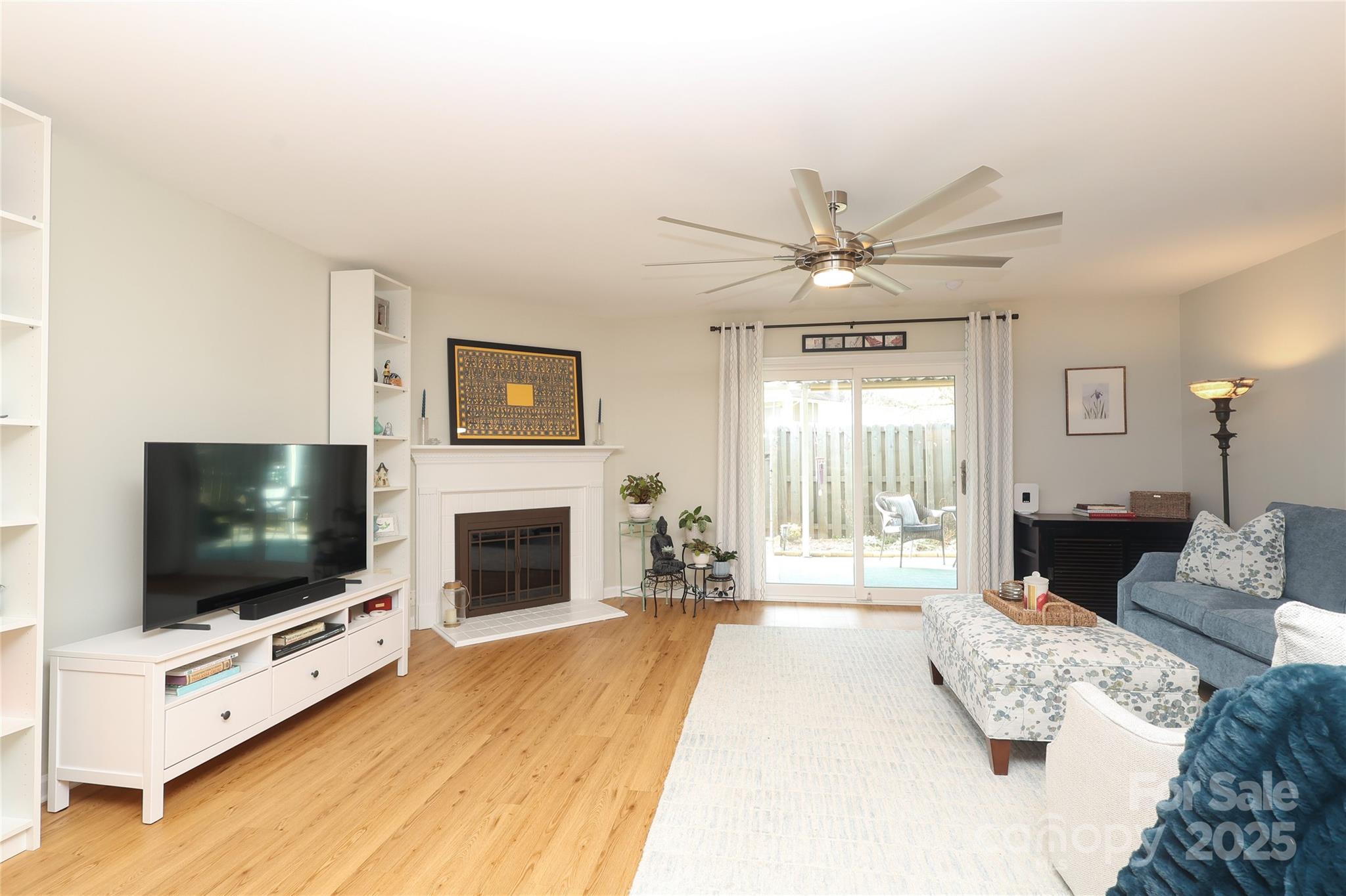 8084 Knights Bridge Road Charlotte, NC 28210 - Photo 3 of 30 a living room with furniture and a flat screen tv