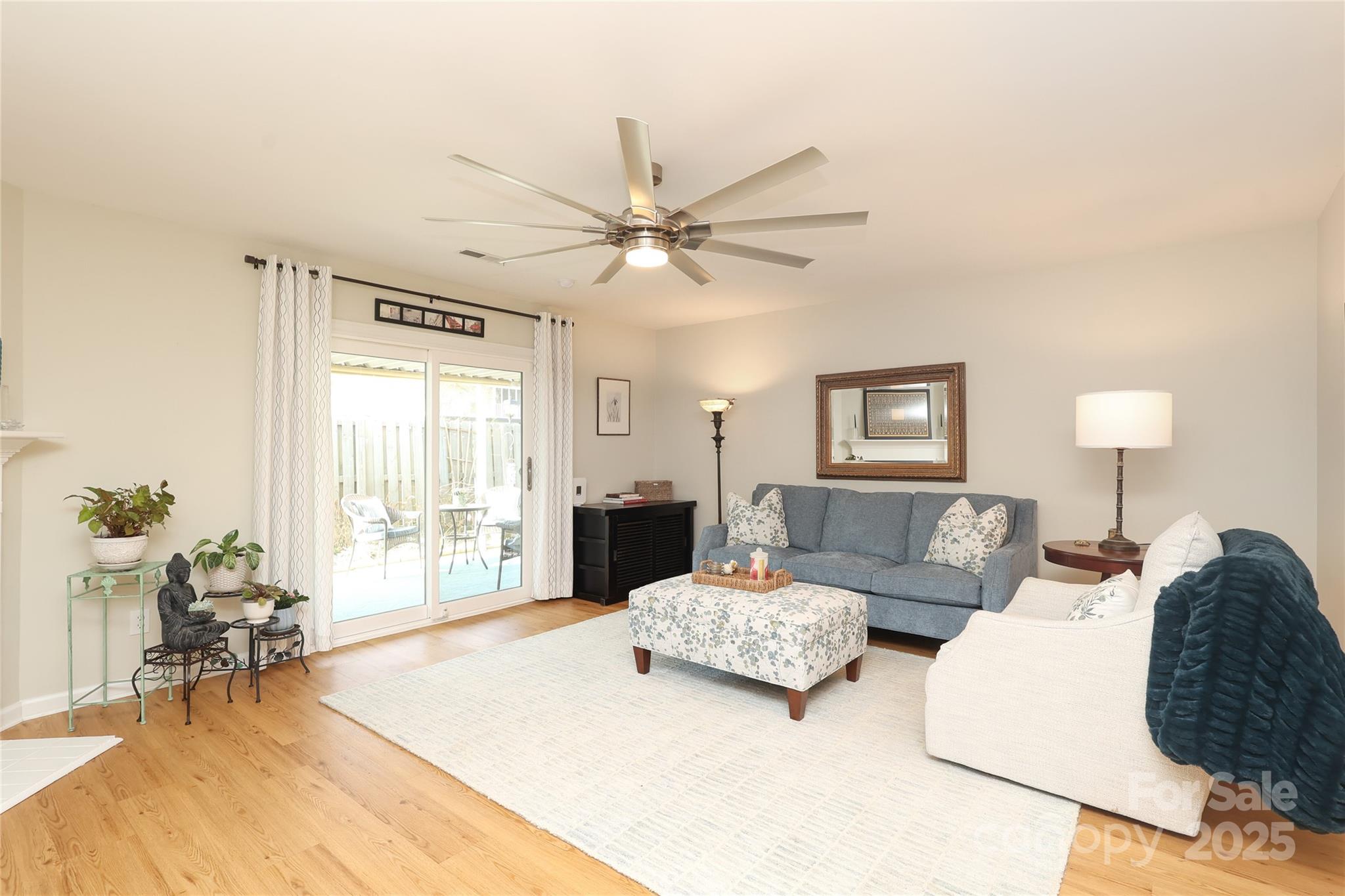 8084 Knights Bridge Road Charlotte, NC 28210 - Photo 4 of 30 a living room with furniture and a large window