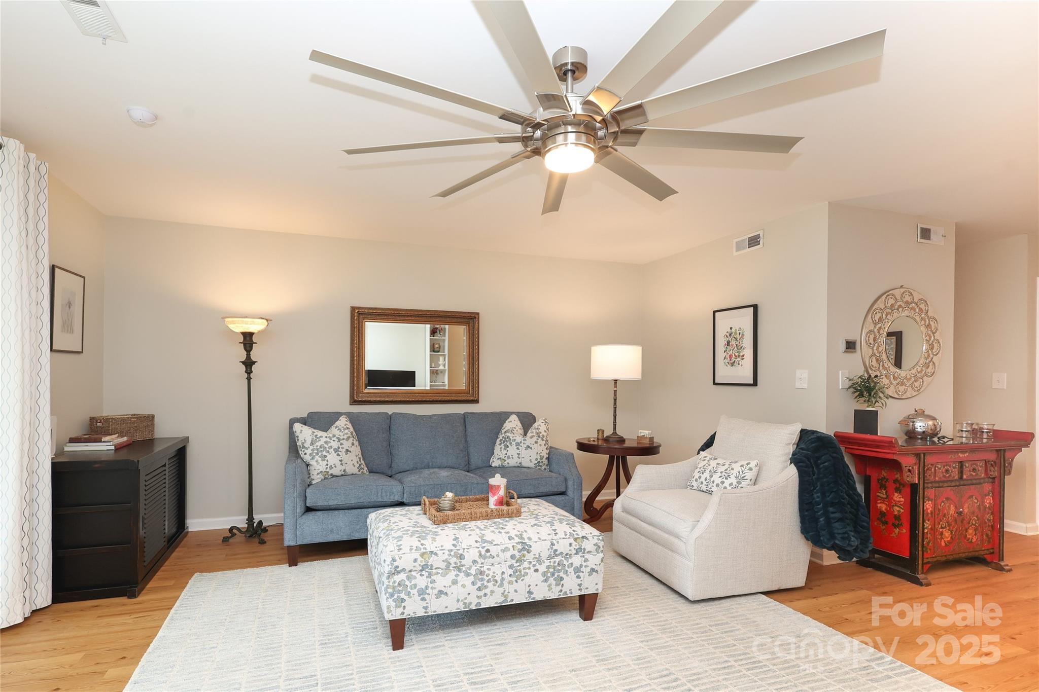 8084 Knights Bridge Road Charlotte, NC 28210 - Photo 5 of 30 a living room with furniture and a window