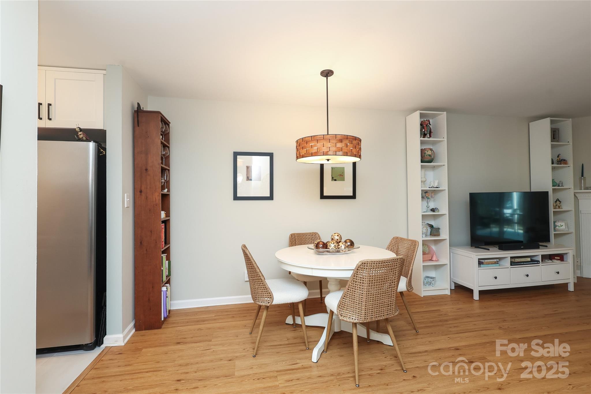 8084 Knights Bridge Road Charlotte, NC 28210 - Photo 7 of 30 a view of a dining room with furniture and wooden floor