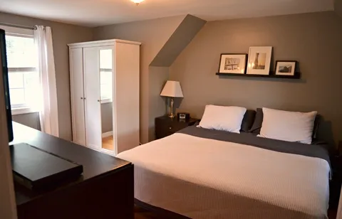 a room with a bed and a window