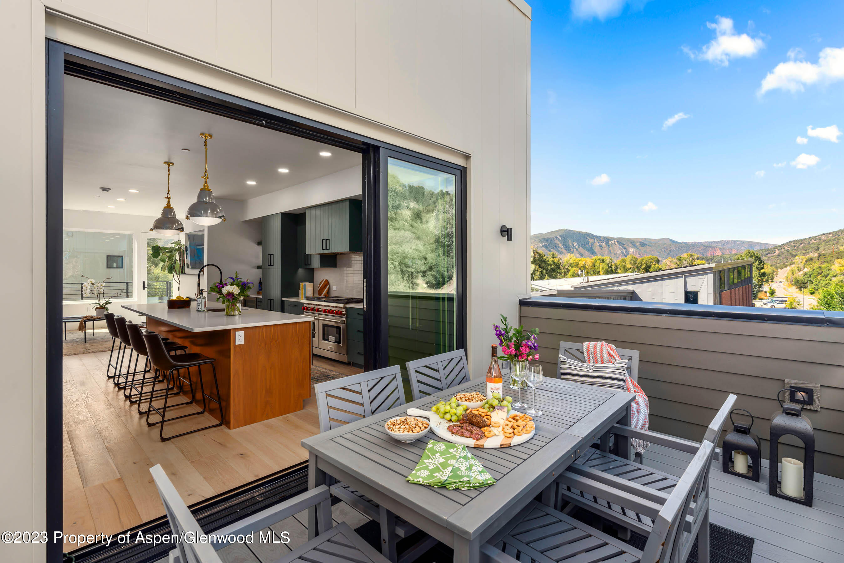 22840 Two Rivers Road, Unit 300 Basalt, CO 81621 - Photo 12 of 28 a living room with furniture and a floor to ceiling window