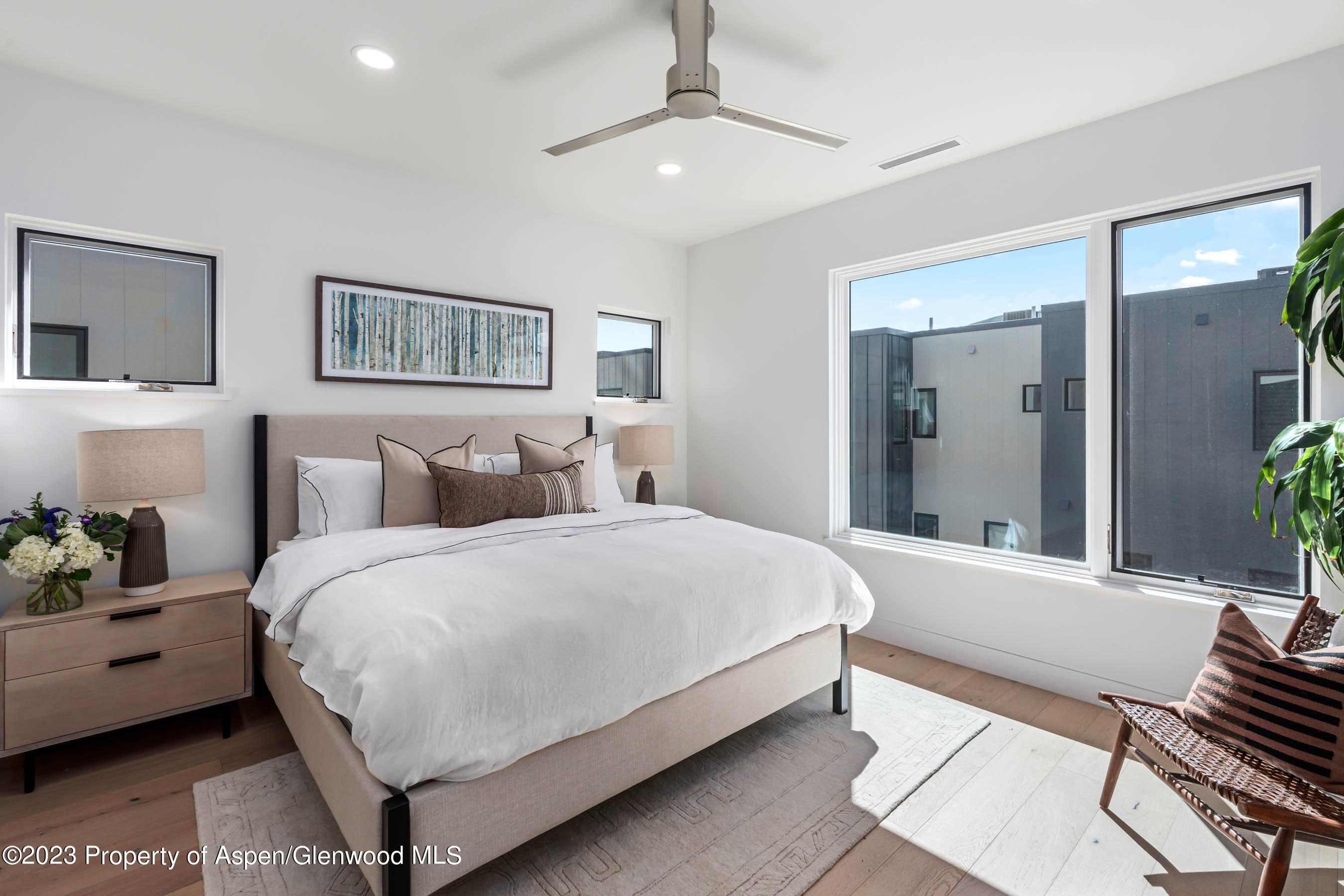 22840 Two Rivers Road, Unit 300 Basalt, CO 81621 - Photo 14 of 28 a spacious bedroom with a bed and a couch